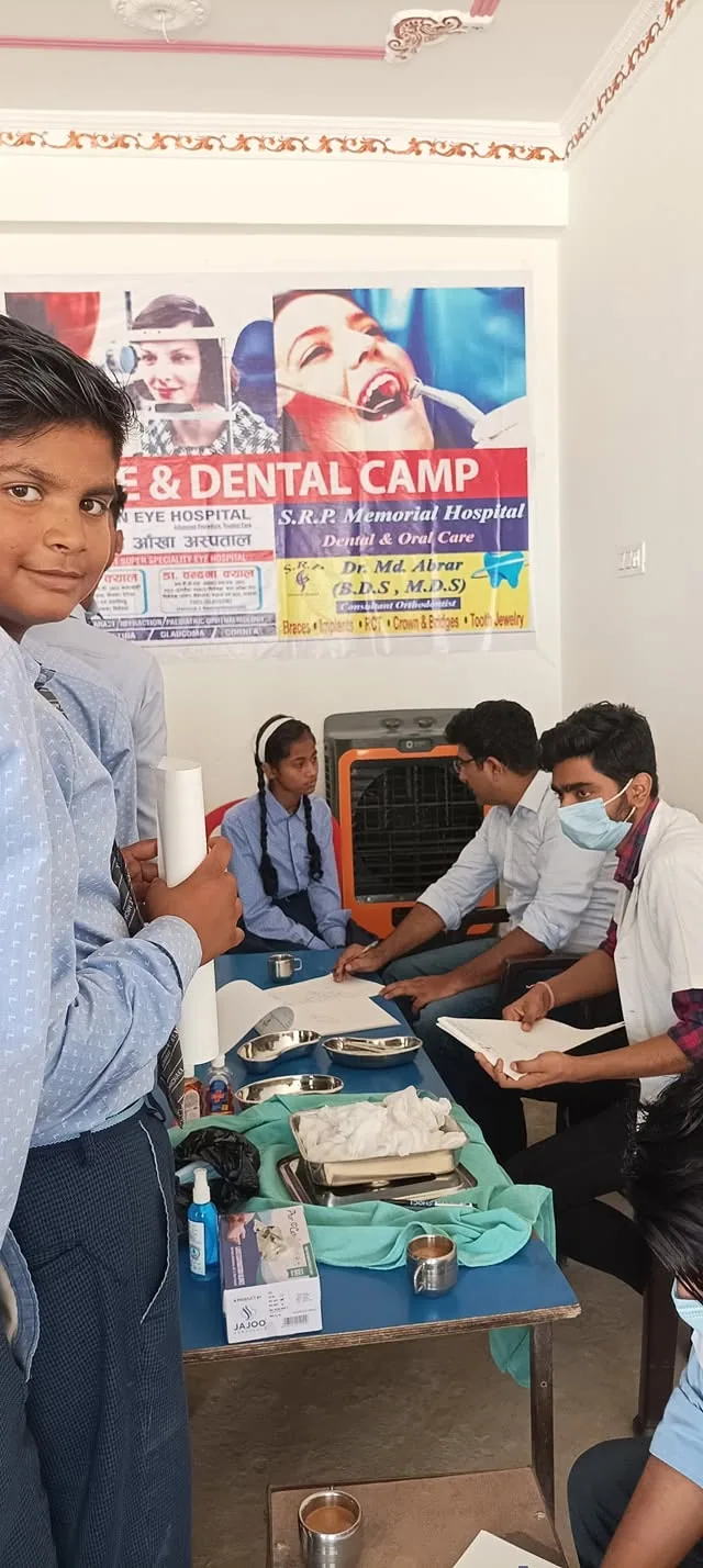 Students queueing at a registration desk for the school health and dental camp